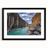 Black-framed landscape artwork showcasing dramatic cliffs and serene scenery, elegantly matted for a polished presentation, ideal for home decor or office spaces.