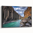 Framed canvas artwork depicting a stunning cliff landscape with vibrant colors and intricate details, showcased from a black side view for a modern aesthetic.