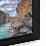 Close-up of a framed canvas artwork depicting vibrant landscapes with dramatic cliffs and textured details, perfect for home decor and art enthusiasts.