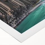 Vibrant rolled canvas print depicting a dramatic landscape of colorful cliffs under a blue sky, showcasing rich textures and natural beauty, perfect for home decor.