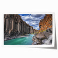 Majestic landscape print depicting dramatic cliffs and serene waters, rolled for easy transport, showcasing vibrant colors and intricate details perfect for home decor.