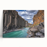 Stretched canvas artwork showcasing a dramatic cliff landscape with vibrant colors, designed for wall decor. Ideal for enhancing modern interior spaces.