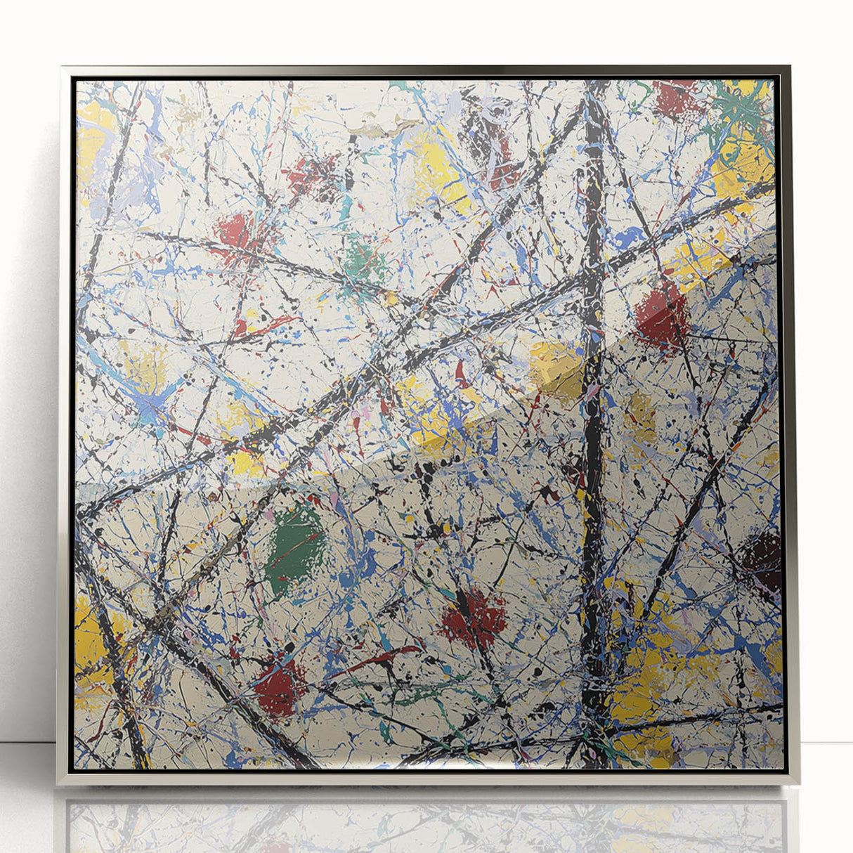 Framed abstract acrylic artwork featuring colorful splatters on a silver background, showcasing a modern design ideal for contemporary home decor.