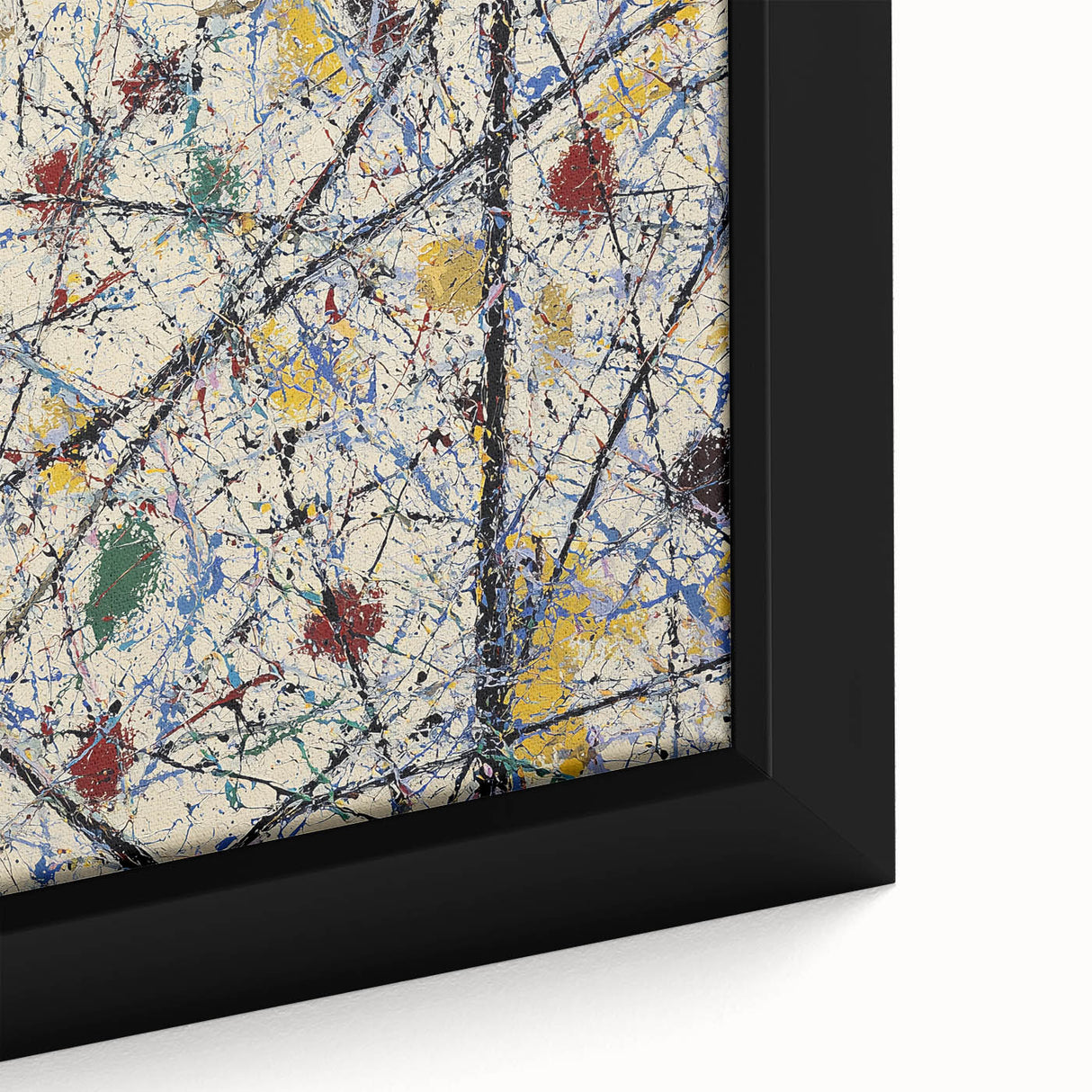 Close-up view of a framed abstract splatter art canvas, showcasing vibrant colors like blue, yellow, and red, ideal for modern home decor or gallery walls.