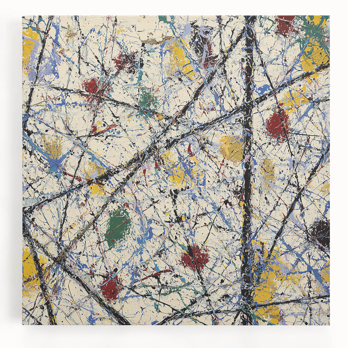 Colorful abstract splatter art on stretched canvas, showcasing vibrant hues of blue, yellow, and red, perfect for modern home decor. Ideal for adding a dynamic touch to any space.