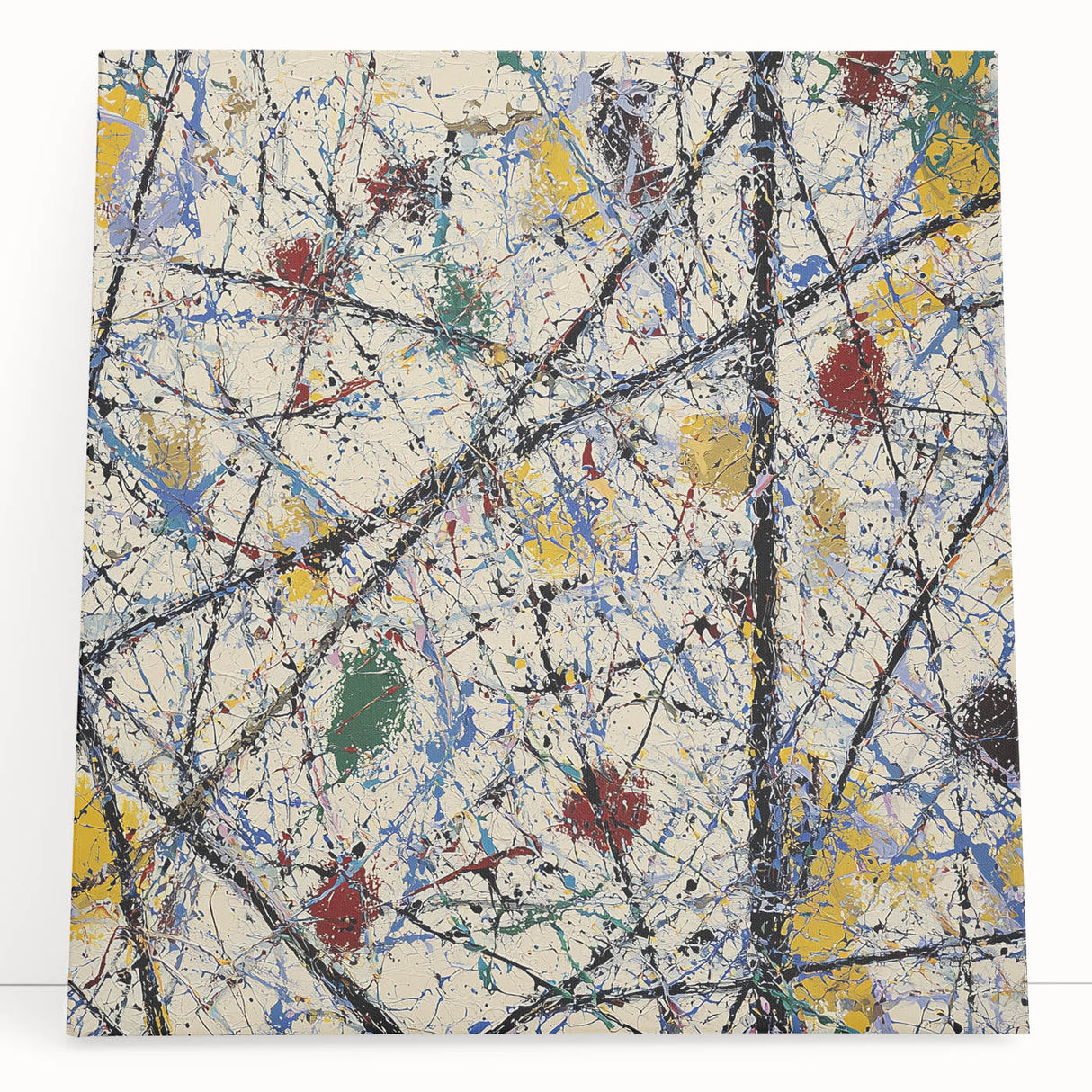 Abstract splatter art canvas featuring vibrant blue, yellow, and red colors, showcasing a dynamic design perfect for modern home decor or art enthusiasts.