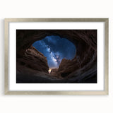 Landscape artwork featuring a stunning canyon scene framed in an elegant silver frame with a white mat, perfect for home decor and nature enthusiasts.