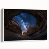 Framed canvas artwork showcasing a vibrant landscape of canyons in warm earthy tones, set against a white background, ideal for enhancing modern home decor.