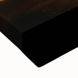 Close-up of a stretched canvas artwork depicting a vibrant desert landscape, showcasing rich colors like warm oranges and deep blues, perfect for home decor.