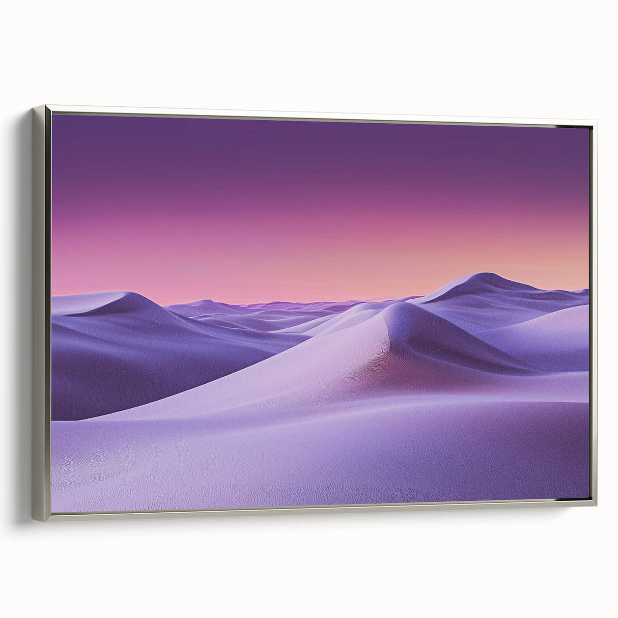 Framed canvas artwork showcasing serene sand dunes in a minimalist silver frame. The landscape captures soft hues of beige and blue, adding tranquility to any room.