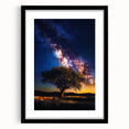 Framed landscape artwork featuring vibrant green fields and a serene sky, presented in a sleek black frame with a white mat, ideal for modern home decor.