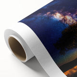 Vibrant rolled canvas artwork showcasing a scenic landscape with fields under a clear blue sky, elegantly packaged in a durable cardboard tube for shipping.