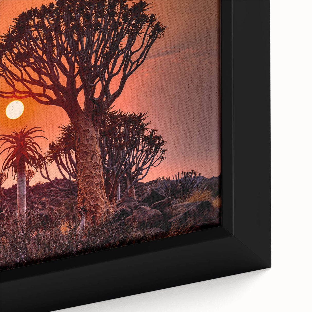 Extra large framed canvas featuring a textured depiction of an African landscape in black with colorful accents.