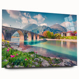 Large abstract wall art of a European scenery in vibrant blues and greens on acrylic glass.