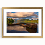Abstract art print of Cumbria's landscape in muted green and blue tones on a framed gold mat.