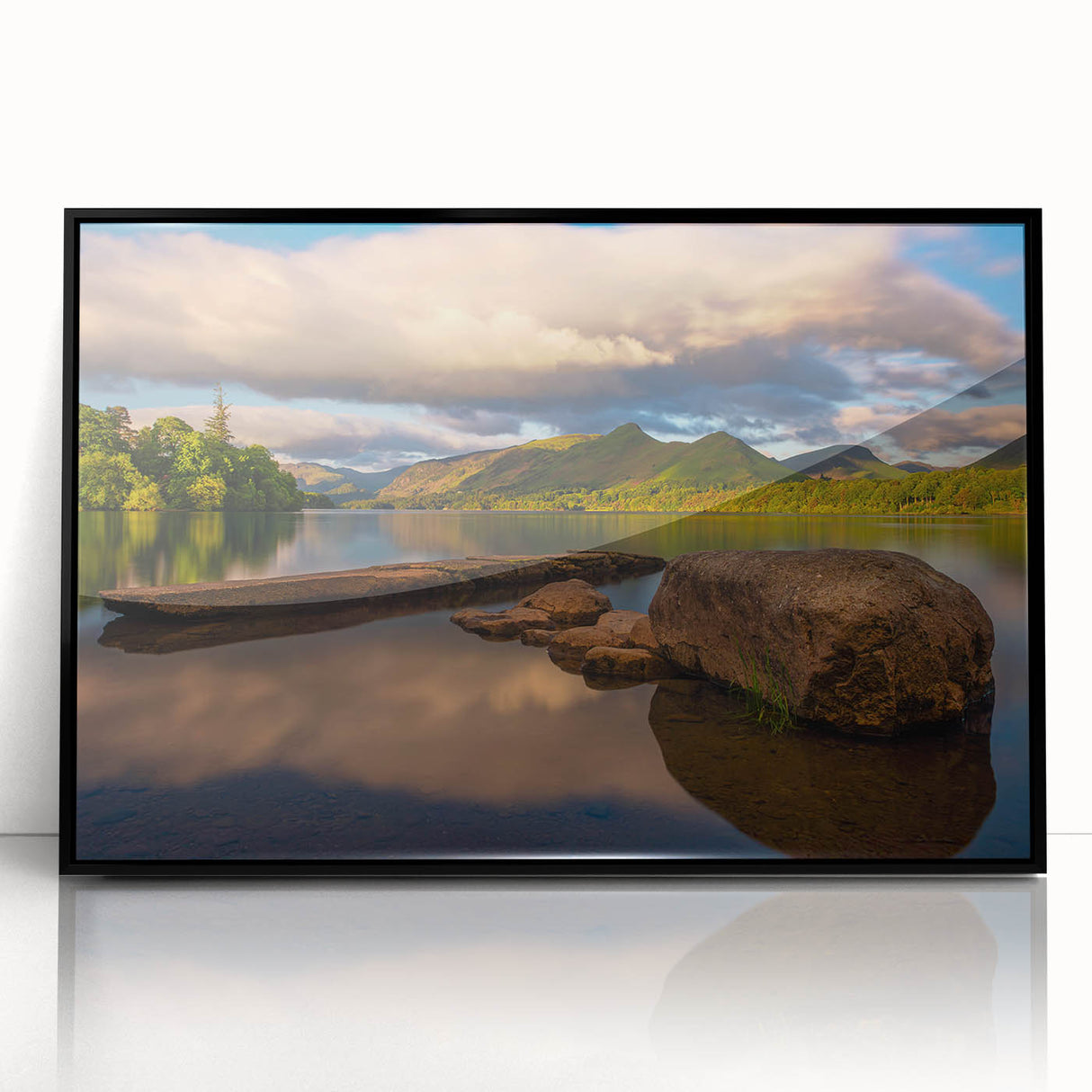 Large abstract wall art depicting a serene Cumbrian landscape in muted greens and blues, framed in black acrylic.
