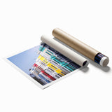 Rolled print of London scenery with floral accents in muted colors, ideal for classy bathroom wall art.