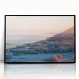 Large abstract wall art depicting a European scenery in muted earth tones, framed in black acrylic.