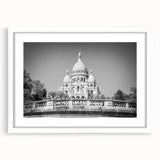 Textured art print of an abstract Paris scenery in muted gray and blue tones on a framed white mat.