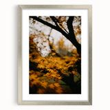 Textured abstract art print featuring autumnal hues on a silver-framed canvas, ideal for bedroom decor.