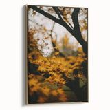 Framed canvas wall art depicting a vintage landscape painting in muted fall colors, ideal for bedroom decor.