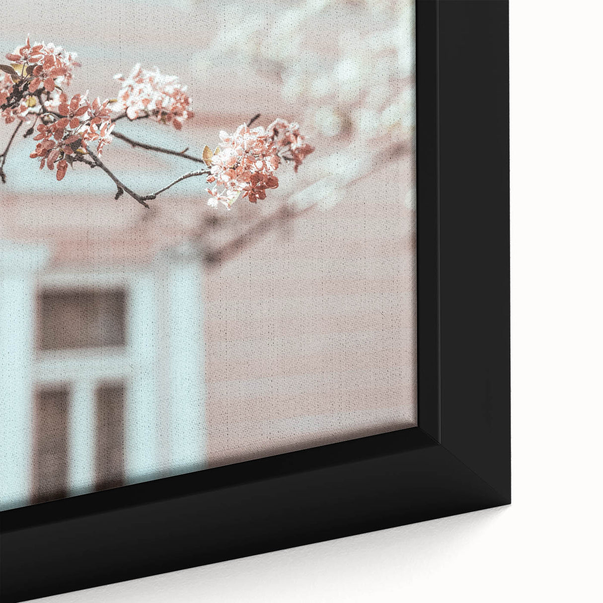Close-up of a black framed canvas featuring a textured, colorful abstract design, ideal for living room decor.