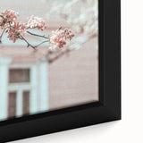Close-up of a black framed canvas featuring a textured, colorful abstract design, ideal for living room decor.