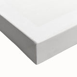 Close-up of a stretched canvas showcasing an abstract minimalist wall art design in soft pastel colors, featuring fluid shapes and textures, perfect for modern decor.