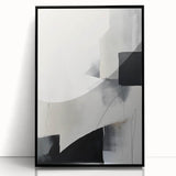 Abstract minimalist wall art in a sleek black frame, showcasing a modern design with geometric shapes, perfect for contemporary home decor.