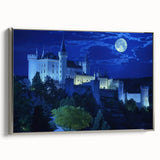 Framed canvas artwork showcasing a picturesque landscape with a medieval castle, elegantly displayed with a silver frame. Perfect for home decor and art enthusiasts.