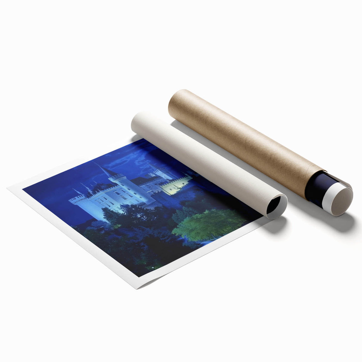 Rolled print showcasing a vibrant landscape featuring a majestic castle surrounded by lush greenery and a clear blue sky, designed for home decor enthusiasts.