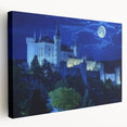 Stretched canvas artwork showcasing a stunning landscape with a medieval castle set against a vibrant sunset, perfect for home or office decor. The rich colors and intricate details create a captivating focal point that enhances any interior space.
