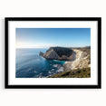 Framed landscape artwork showcasing dramatic cliffs in a black mat finish, perfect for home decor, emphasizing natural beauty and artistic design.