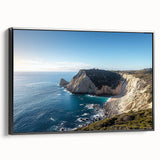 Framed canvas artwork depicting serene coastal cliffs at sunset, featuring vibrant colors and a sleek black frame, perfect for modern home decor.