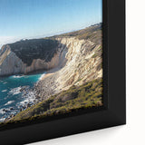 Close-up of a framed canvas print showcasing a stunning landscape of cliffs, featuring rich textures and vibrant colors, perfect for home decor.