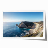 Stunning rolled print showcasing a serene landscape of cliffs against a vivid blue sky, perfect for home decor, elegantly packaged in a protective tube.