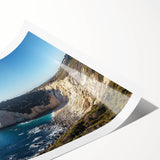 Stunning landscape print showcasing dramatic cliffs and vibrant blue skies, rolled in a protective tube, perfect for home decor enthusiasts seeking nature-inspired art.