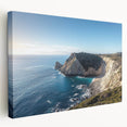 Stretched canvas artwork depicting a dramatic cliff landscape under a vibrant sunset, showcasing rich colors and intricate details, perfect for home decor.