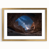 Framed landscape artwork depicting majestic canyons in rich gold tones, with a mat border enhancing its elegance, ideal for home decor or office settings.