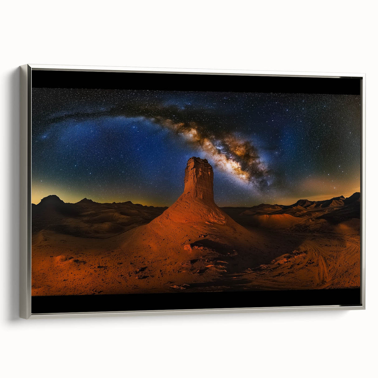 Framed canvas artwork showcasing a stunning desert landscape with vibrant colors, elegantly bordered in silver, perfect for home decor or office ambiance.