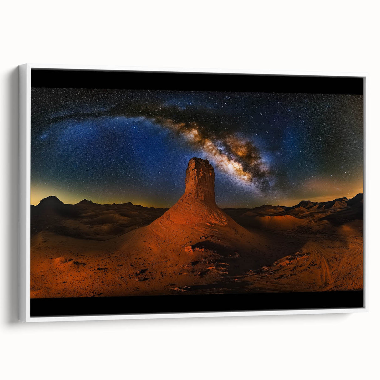 Framed canvas artwork depicting a serene desert landscape with warm tones of orange and yellow, mounted on a white frame, ideal for modern home decor.