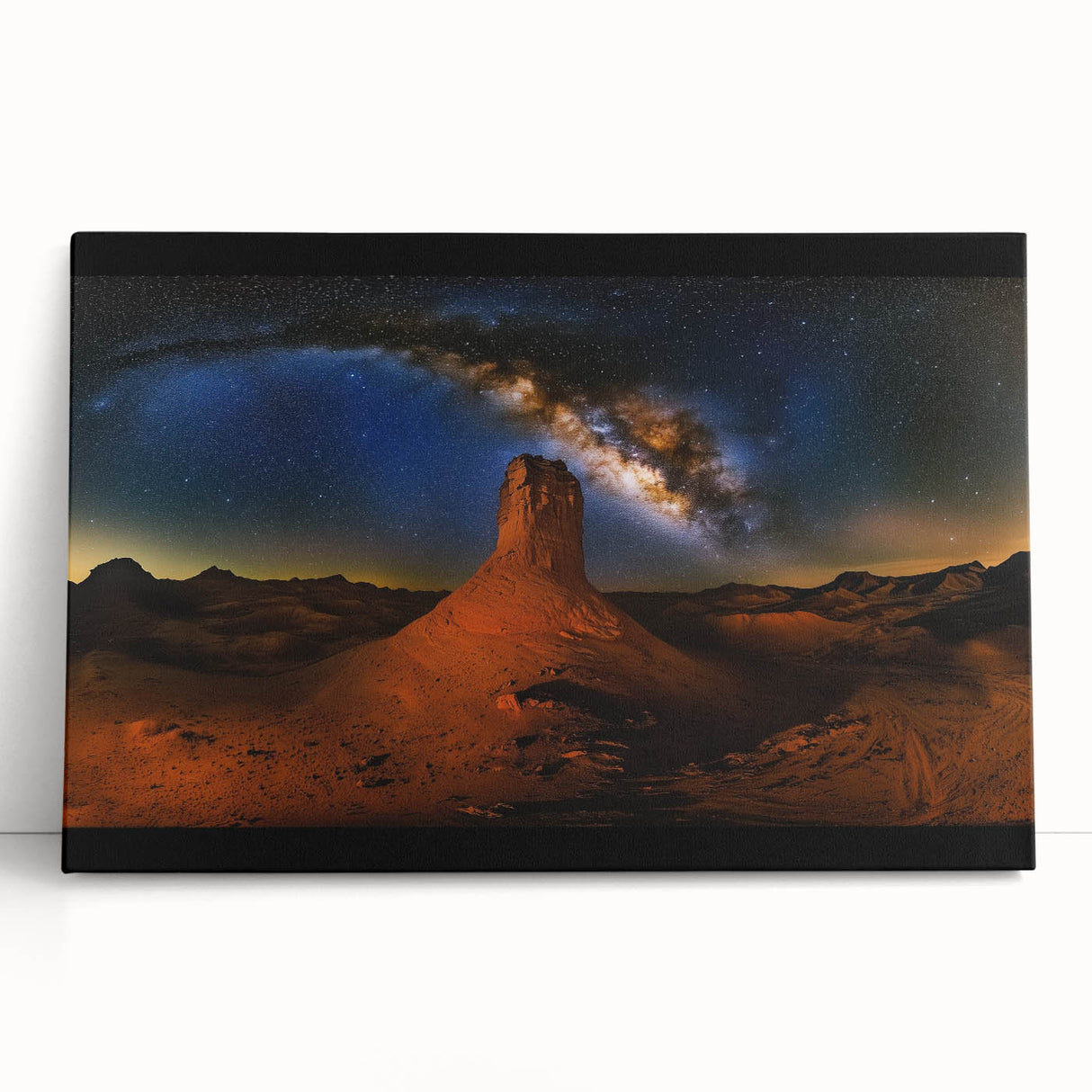 Desert landscape stretched canvas art leaning against a wall, showcasing warm tones of beige and orange, perfect for home decor and nature enthusiasts.