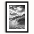Framed landscape art print showcasing serene sand dunes in neutral tones, elegantly matted and presented in a sleek black frame, ideal for modern home decor.