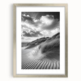 Framed landscape artwork showcasing serene sand dunes in soft beige and warm gold tones, elegantly matted and presented in a sleek silver frame, perfect for home decor.