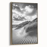 Framed canvas artwork showcasing a serene landscape of rolling sand dunes under a clear blue sky, featuring a gold frame that adds elegance to any decor. Ideal for modern home or office settings.