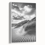 Framed canvas artwork featuring serene desert dunes in soft beige and gold tones, displayed against a white wall, perfect for modern home decor.