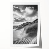 Desert landscape print showcasing golden sand dunes under a clear blue sky, rolled and packaged in a protective cardboard tube for safe shipping.