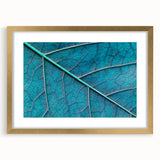Extra large abstract art print of textured leaves in gold frame, ideal for living room decor.