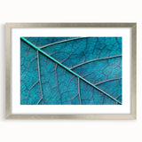 Textured art depicting close-up leaves in abstract style, framed in silver, suitable for bedroom decor.