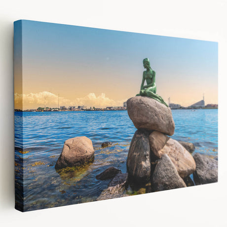 Side view of a large stretched canvas featuring a serene Denmark landscape in soft blue and green tones.